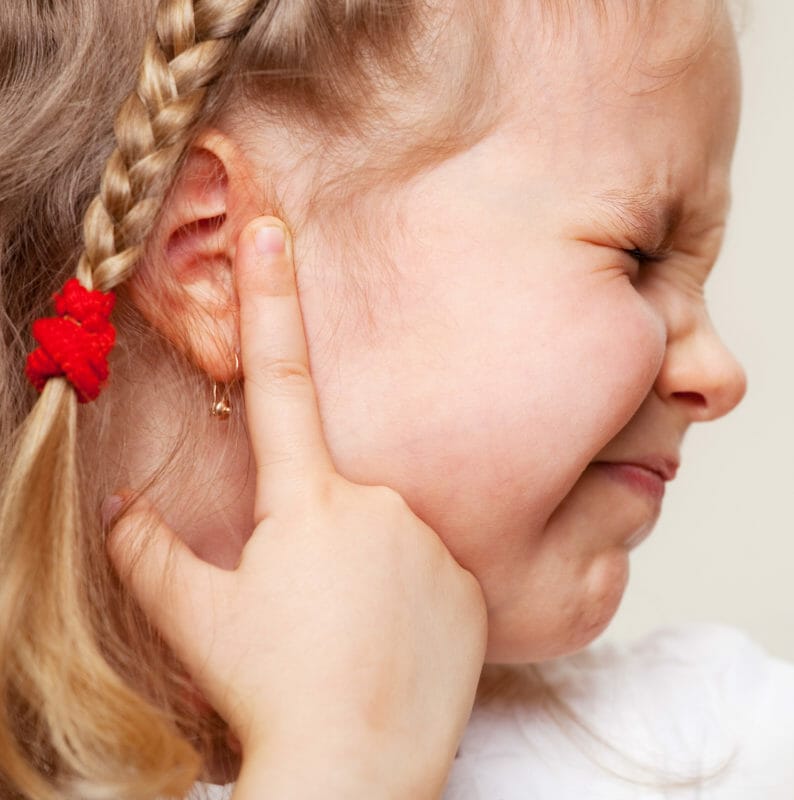 Young girl suffering from glue ear